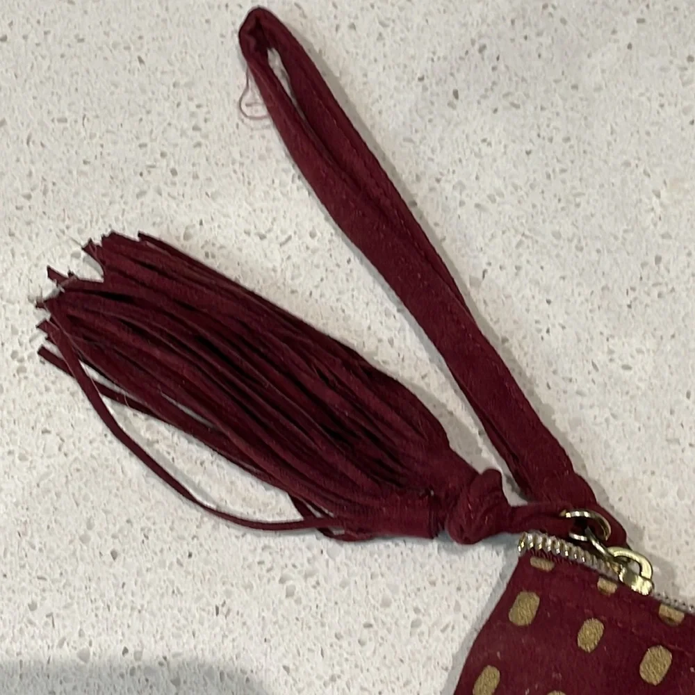 Kit & Luc maroon gold suede tassel zip cosmetics bag